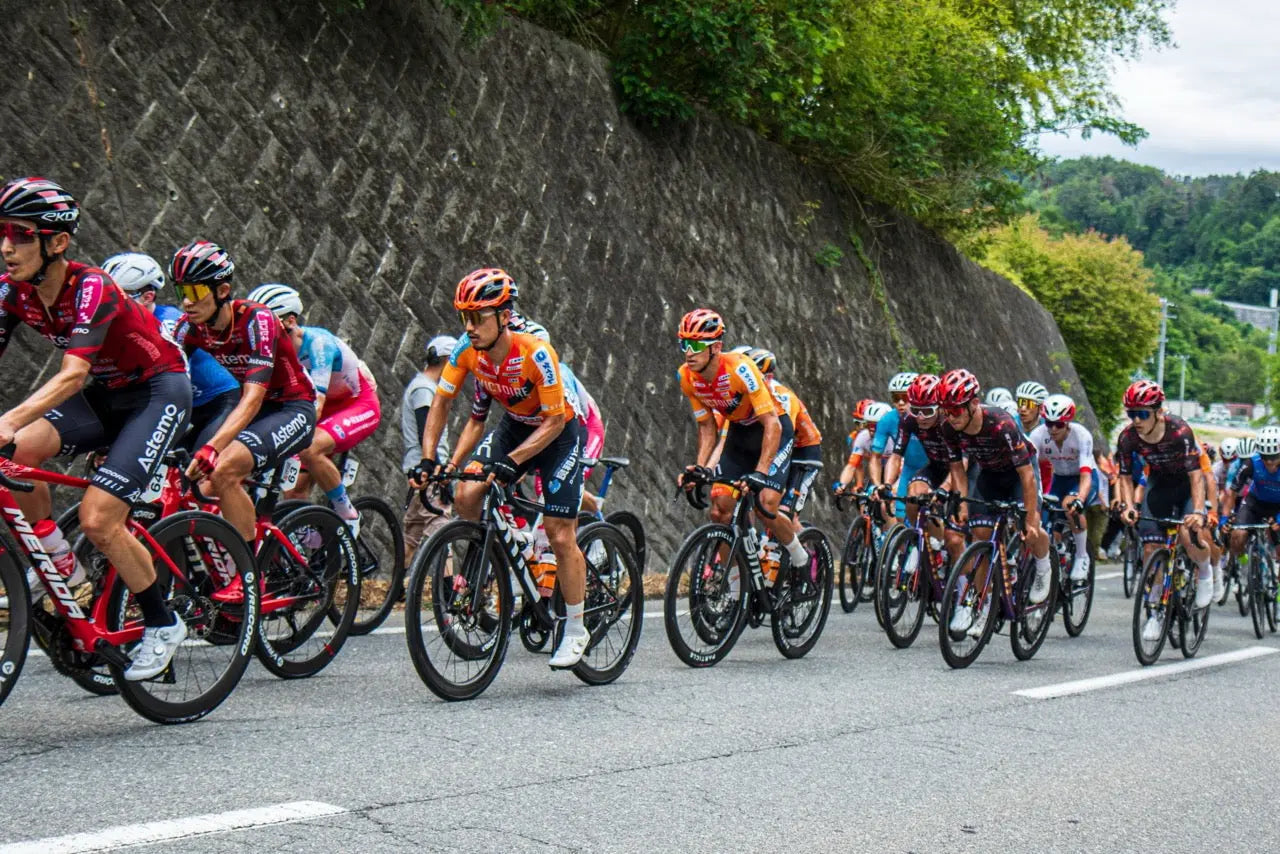 A cyclist racing Particle carbon wheels